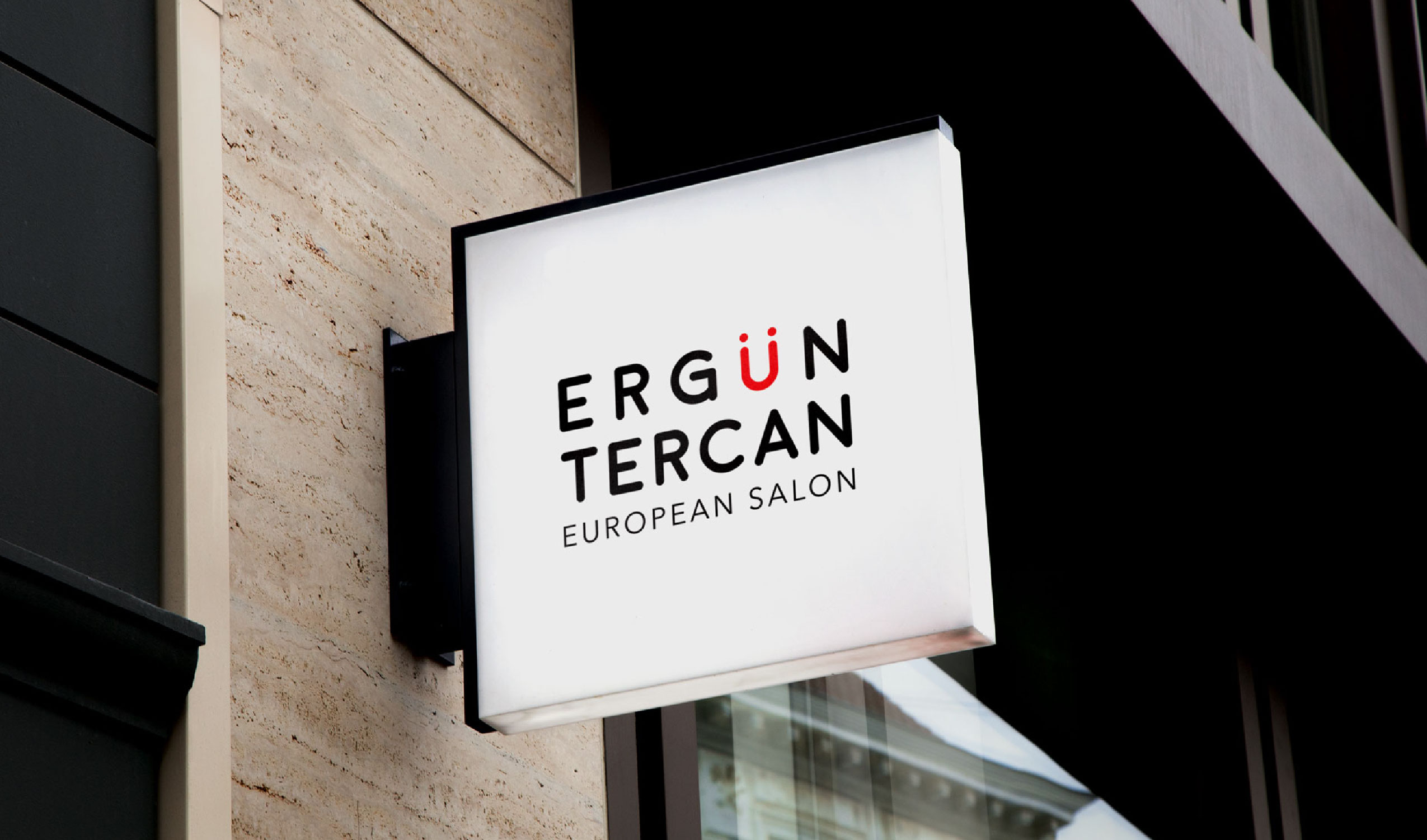 Ergun Tercan logo on a square building sign