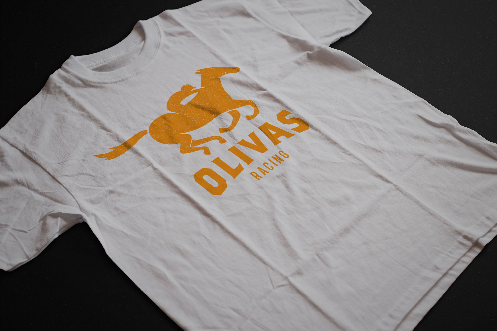 White tshirt with the Olivas Racing logo in orange